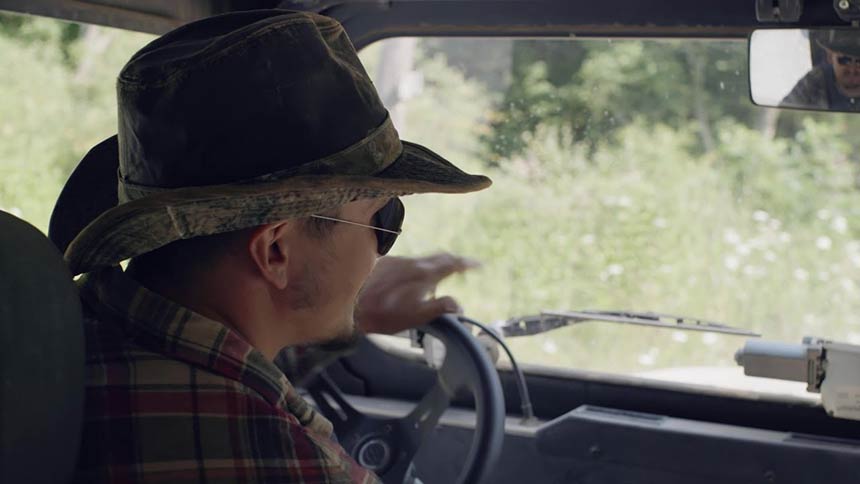Photo of a man driving a truck